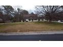 Charming single-story home featuring a cozy front porch and a traditional, well-maintained lawn at 2326 Noahs Ark Rd, Jonesboro, GA 30236