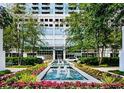 Serene exterior view with a water feature surrounded by colorful flowers and lush greenery at 3324 Peachtree Ne Rd # 1116, Atlanta, GA 30326