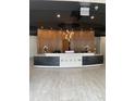 Inviting lobby area featuring a modern reception desk and elegant lighting fixtures at 3324 Peachtree Ne Rd # 1116, Atlanta, GA 30326