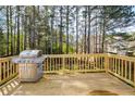 Spacious wooden deck with stainless steel grill perfect for outdoor entertaining and cooking at 6065 Nw Gentlewind Court Nw Ct, Powder Springs, GA 30127