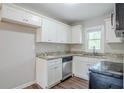 Kitchen features white cabinets, granite countertops, and stainless steel dishwasher at 3436 Misty Valley Rd, Decatur, GA 30032