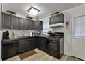 Modern kitchen featuring sleek cabinetry, updated appliances, and ample counter space at 2344 Johnson Ferry Ne Rd, Atlanta, GA 30341