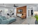 Bright living room featuring modern decor, stylish furniture, and sleek wooden accent wall at 2535 Judson Ave, East Point, GA 30344