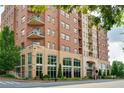 Elegant brick building with large windows, offering stunning city views and modern architecture at 326 Roswell Se St # 706, Marietta, GA 30060