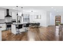 Bright kitchen boasts an island, stainless steel appliances and an open-concept design at 1560 New Ne St, Atlanta, GA 30307