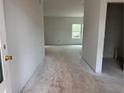 The hallway offers seamless flow into the house and features a window for natural light at 2096 Boxwood Cir, Conyers, GA 30094