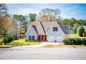 Attractive two-story home with a lush green lawn and a two-car garage at 207 Meadow Lake Dr, Carrollton, GA 30116