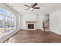 Spacious living room boasts a cozy fireplace, large windows, and hardwood floors at 2350 Edgar Park Pl # 98, Duluth, GA 30096