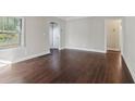 Inviting living room featuring gleaming hardwood floors, neutral wall paint, and natural light at 1563 Mayflower Sw Ave, Atlanta, GA 30311