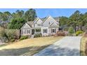 Beautifully landscaped lawn, long driveway, and a charming exterior create the perfect curb appeal at 304 Gilmer Ct, Canton, GA 30115