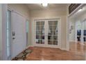 Inviting foyer with hardwood floors, arched doorway and French doors leading to office at 51 Muirfield Ct, Hiram, GA 30141