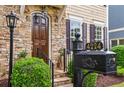 Close-up of the home's entrance, highlighting the stone facade, wood door, and decorative mailbox at 4224 Gateland Ave, Marietta, GA 30062