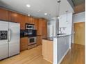 Open kitchen with stainless steel appliances, dark countertops, and a breakfast bar at 923 Peachtree Ne St # 1334, Atlanta, GA 30309