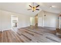 Open concept living room boasts hardwood floors, a vaulted ceiling, and easy access to the kitchen at 3640 Barbara Dr, Douglasville, GA 30135