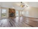 Spacious living room featuring hardwood floors and a stone fireplace at 3640 Barbara Dr, Douglasville, GA 30135