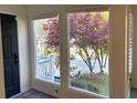 Bright foyer with windows offering a scenic view of a tree-lined street and landscaped front yard at 2362 Virginia Ne Pl, Atlanta, GA 30305