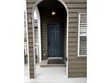 A charming home entryway showcasing a dark blue front door and classic architectural details at 2362 Virginia Ne Pl, Atlanta, GA 30305
