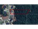 Aerial view of property showcasing the surrounding mature trees and a large lot at 305 Red Gate Ln, Canton, GA 30115