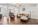 Inviting living room boasts hardwood floors, coffered ceilings, and elegant columns at 7554 Roseberry Way, Lithonia, GA 30038