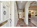 Inviting foyer with brick flooring, arched entry, and view into the living area at 41 Palisades Ne Rd, Atlanta, GA 30309