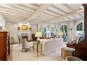 Bright living room with white beamed ceiling, fireplace, and arched windows at 41 Palisades Ne Rd, Atlanta, GA 30309