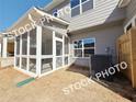 The cozy screened-in back porch offers a relaxing outdoor living space with views to the backyard at 1367 Fern Ridge Ct # 31, Norcross, GA 30093