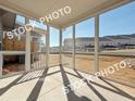 Inside the screened in back porch, a concrete floor provides the perfect outdoor living space at 1367 Fern Ridge Ct # 31, Norcross, GA 30093