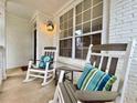 Comfortable rocking chairs and pillows adorn the charming front porch of this lovely home at 2168 Berryhill Se Cir, Smyrna, GA 30082