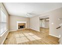 Spacious living room features stylish wood-look flooring and a cozy fireplace at 2876 Davis Mill N Rd, Dallas, GA 30157