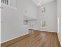 Spacious living room featuring hardwood floors, high ceilings, and ample natural light at 3417 Sable Chase Ln, Atlanta, GA 30349