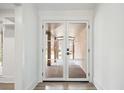 Bright entryway features glass paneled doors, letting in ample natural light at 5361 Seaton Way, Dunwoody, GA 30338