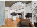 Modern kitchen with island, breakfast bar and stainless steel appliances at 860 Peachtree Ne St # 2503, Atlanta, GA 30308