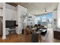 Spacious living room featuring a desk and city view at 860 Peachtree Ne St # 2503, Atlanta, GA 30308
