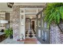 Welcoming foyer with black and white checkered floors and elegant chandelier at 2628 Rivers Nw Rd, Atlanta, GA 30305