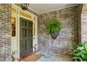 Inviting front porch with brick walls and stylish accents at 2628 Rivers Nw Rd, Atlanta, GA 30305