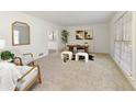 Inviting living room featuring neutral carpet, natural light, and elegant, minimalist decor at 520 Willeo Rd, Roswell, GA 30075