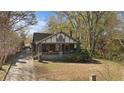 Lovely two-story home with brick and stone accents and a lush green lawn at 1716 Rogers Sw Ave, Atlanta, GA 30310