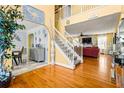 Inviting two-story entryway featuring hardwood floors and an open staircase at 859 Pownal Ln, Hampton, GA 30228