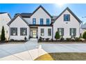 Charming home with manicured lawn, elegant brick facade, and inviting front entrance at 109 Owens Mill Pl, Canton, GA 30115