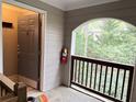 Inviting condo entrance with neutral colors and a beautiful green view from the condo's outdoor patio at 507 Madison Se Ct, Smyrna, GA 30080