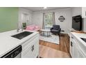 Stylish kitchen with sleek countertops, stainless steel appliances, and a seamless flow into the living area at 2612 Clairmont Ne Rd, Atlanta, GA 30329