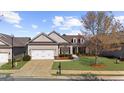 Charming home featuring manicured lawn, attached garage and lovely landscaping at 722 Laurel Canyon Pkwy, Canton, GA 30114