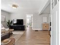 Bright and airy living room featuring hardwood floors, neutral decor, and modern furnishings at 119 Old Vandiver Dr, Canton, GA 30114