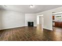 Spacious living room featuring beautiful wood-look tile flooring and a fireplace at 2970 Aspen Woods Entry, Atlanta, GA 30360