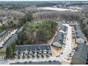 Aerial view of a neighborhood with townhomes nestled among mature trees at 3132 Meadowstone Sw Ln, Atlanta, GA 30331