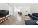 Open-concept living room with durable flooring and modern furnishings at 89 De Arc Nw Pl, Atlanta, GA 30327