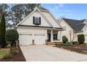 Charming two-story home featuring a well-maintained front yard and a two-car garage at 1814 Dupont Nw Ave, Atlanta, GA 30318