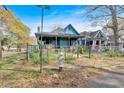 Charming home on a corner lot with a welcoming porch, partially surrounded by a chain link fence at 638 Bryan Se St, Atlanta, GA 30312