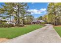 Beautiful brick home with an inviting entrance and a long drive leading to the residence at 315 Monroe Dr, Mcdonough, GA 30252