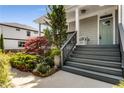 Inviting front entrance featuring landscaped gardens and a welcoming staircase leading to the front door at 1324 Cambridge Ave. Sw, Atlanta, GA 30344